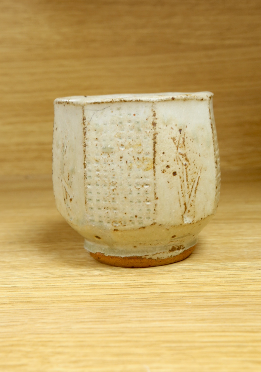 Phil Rogers (1951-2020), a studio pottery octagonal yunomi, 9cm. Condition - good, some crazing visible to interior